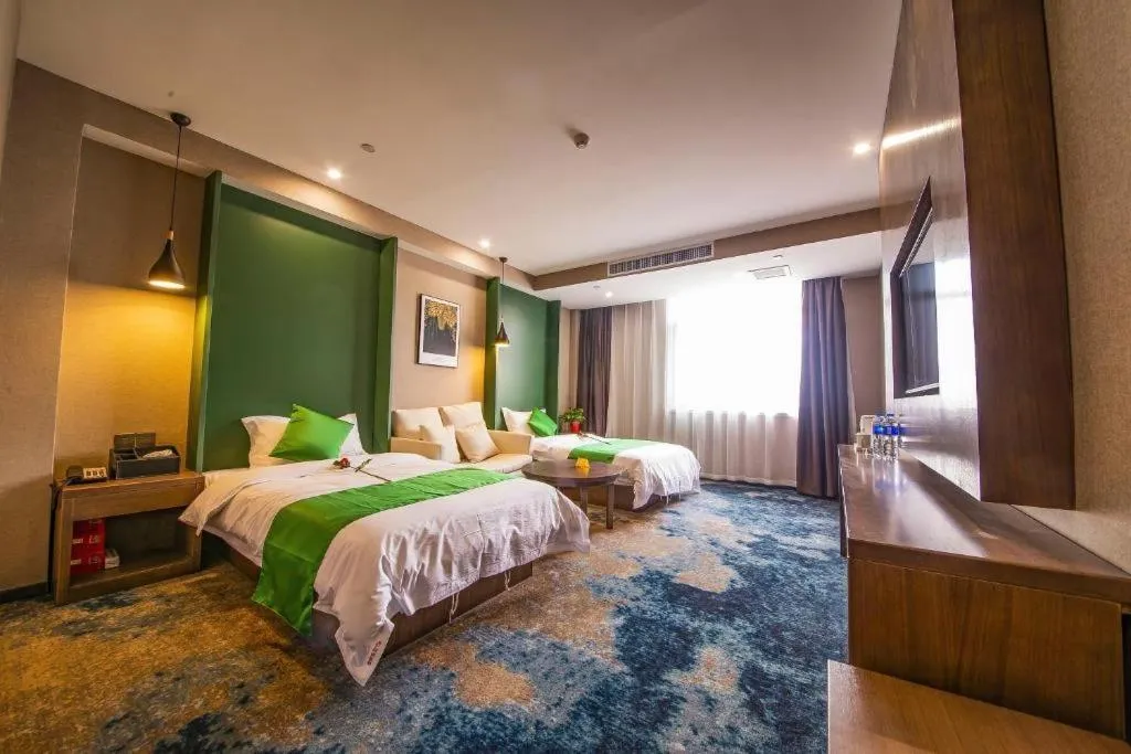 Bed in Shell Hotel Zhengzhou East High-Speed Railway Station Zhengdong Commerical Center
