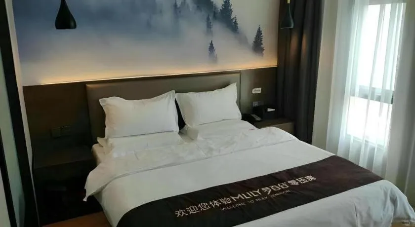 Bed in Shell Hotel Zhengzhou East High-Speed Railway Station Zhengdong Commerical Center