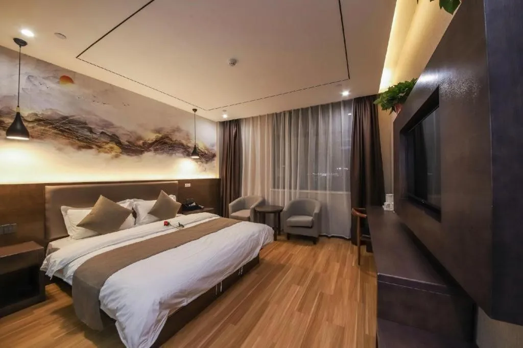 Bed in Shell Hotel Zhengzhou East High-Speed Railway Station Zhengdong Commerical Center