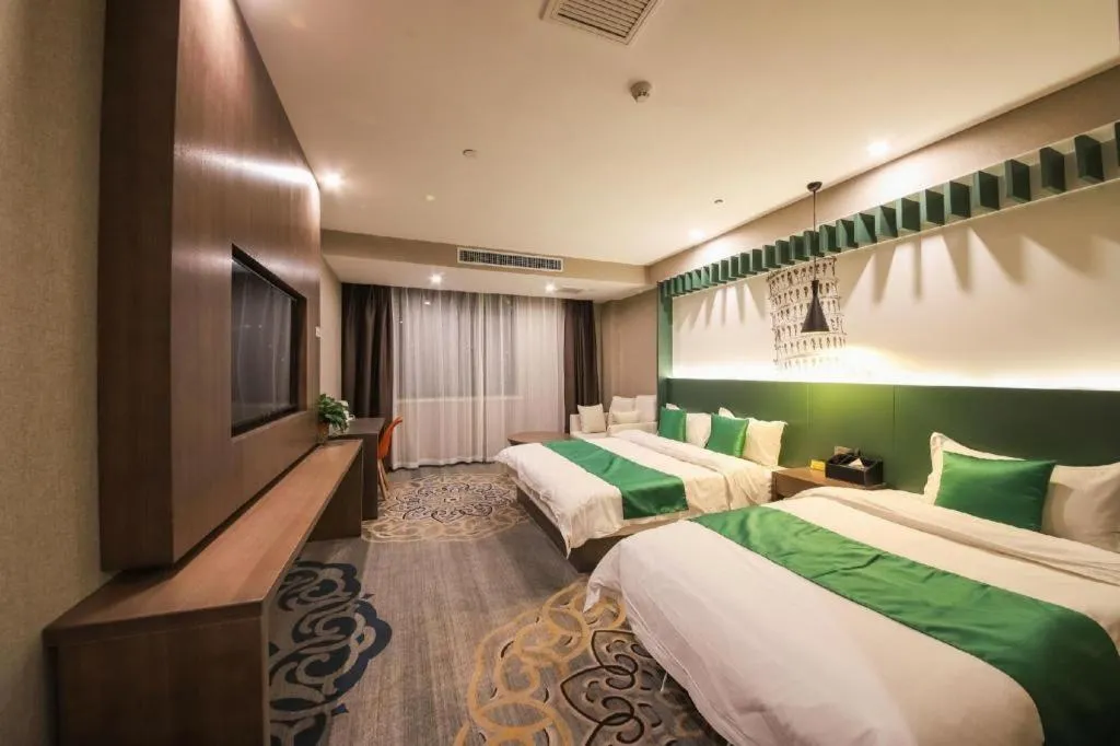 Bed in Shell Hotel Zhengzhou East High-Speed Railway Station Zhengdong Commerical Center