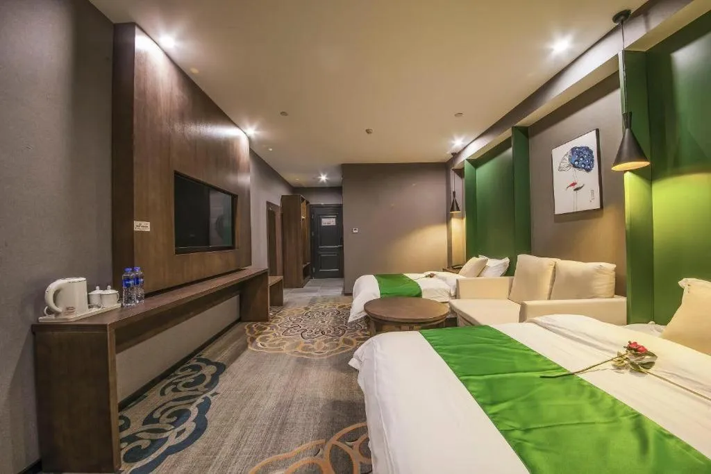 Bed in Shell Hotel Zhengzhou East High-Speed Railway Station Zhengdong Commerical Center