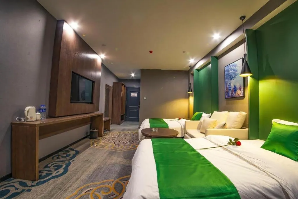 Bed in Shell Hotel Zhengzhou East High-Speed Railway Station Zhengdong Commerical Center