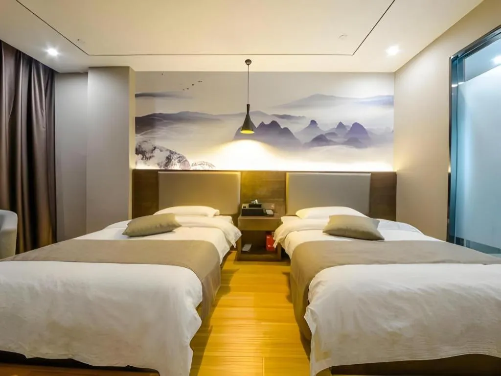 Bed in Shell Hotel Zhengzhou East High-Speed Railway Station Zhengdong Commerical Center