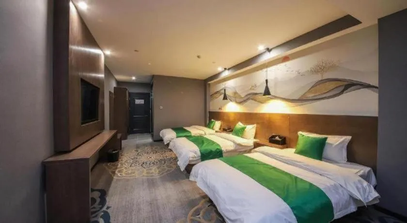 Bed in Shell Hotel Zhengzhou East High-Speed Railway Station Zhengdong Commerical Center