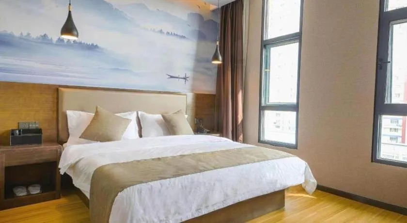 Bed in Shell Hotel Zhengzhou East High-Speed Railway Station Zhengdong Commerical Center