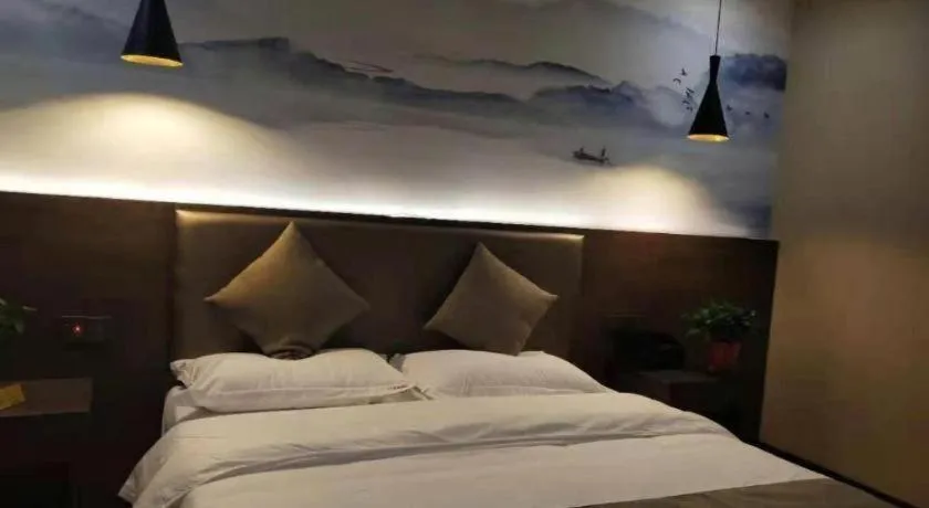 Bed in Shell Hotel Zhengzhou East High-Speed Railway Station Zhengdong Commerical Center