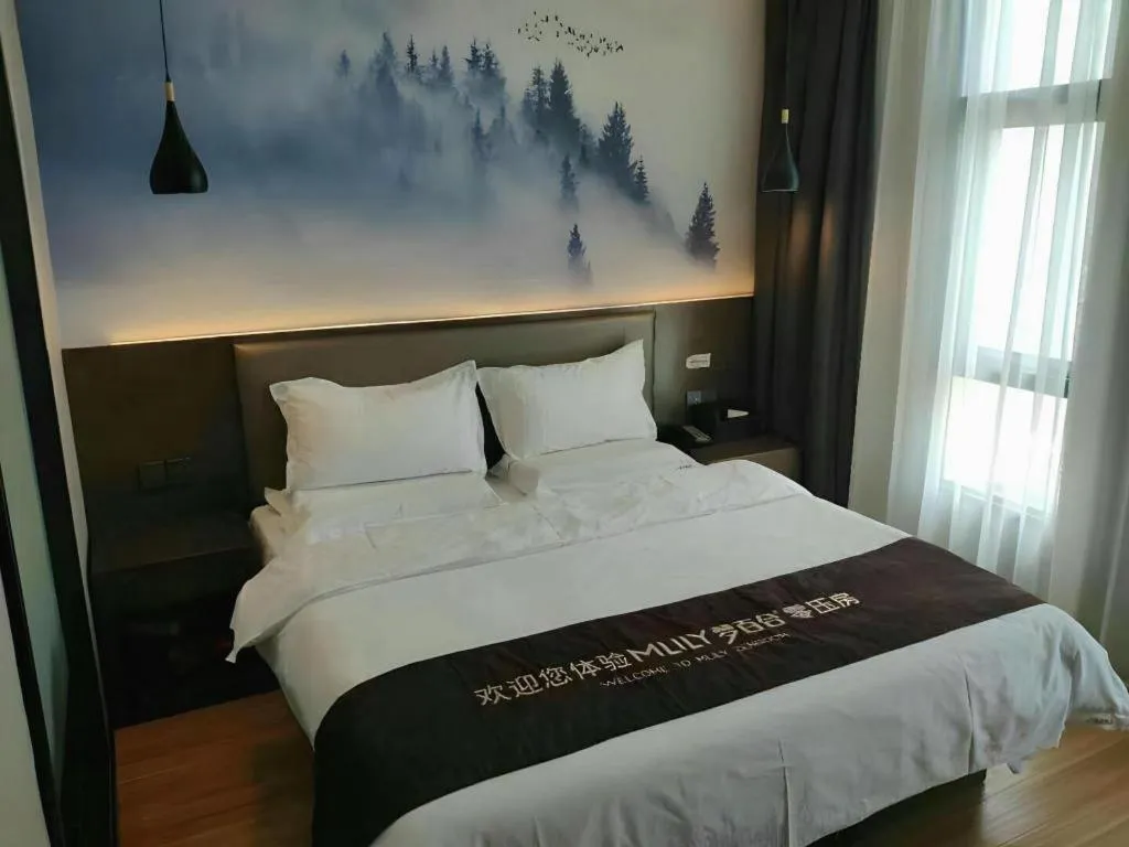 Bed in Shell Hotel Zhengzhou East High-Speed Railway Station Zhengdong Commerical Center