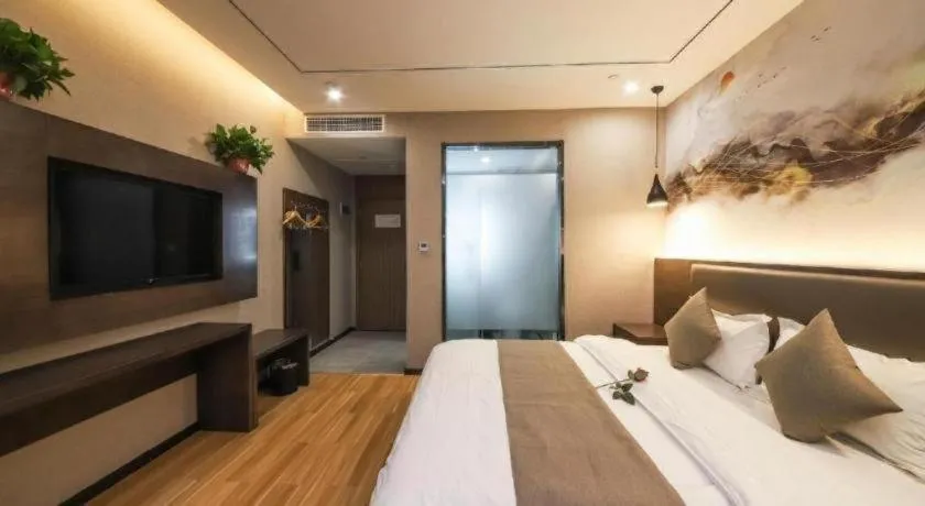 Bed in Shell Hotel Zhengzhou East High-Speed Railway Station Zhengdong Commerical Center