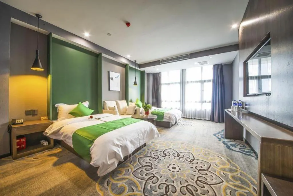 Bed in Shell Hotel Zhengzhou East High-Speed Railway Station Zhengdong Commerical Center