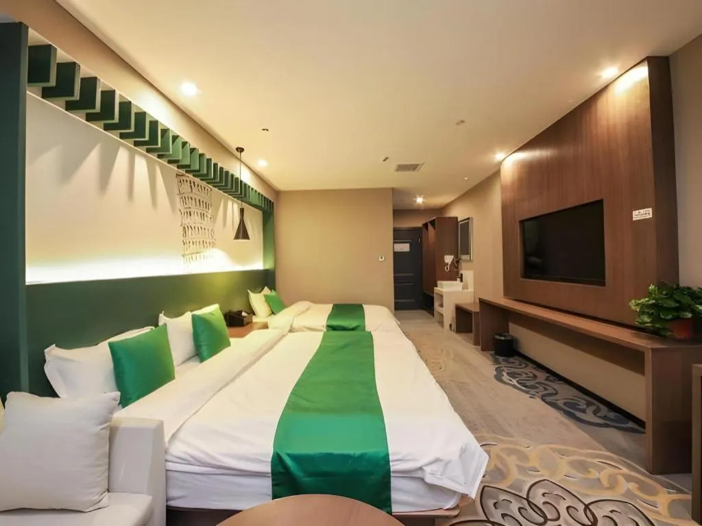 Bed in Shell Hotel Zhengzhou East High-Speed Railway Station Zhengdong Commerical Center