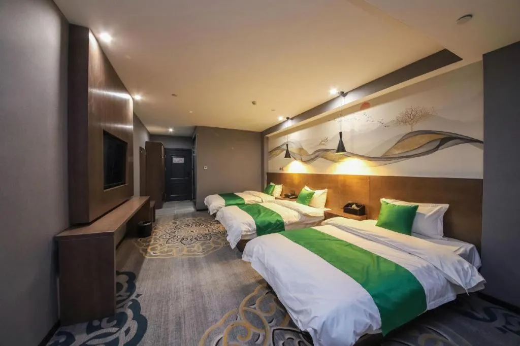 Bed in Shell Hotel Zhengzhou East High-Speed Railway Station Zhengdong Commerical Center