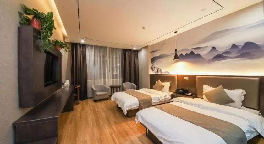 Bed in Shell Hotel Zhengzhou East High-Speed Railway Station Zhengdong Commerical Center