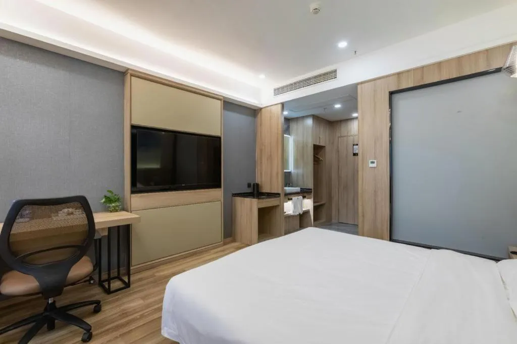 Bed in VX Hotel Jiangsu Taizhou Xinghua RT-Mart