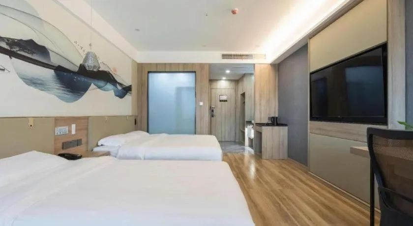 Bed in VX Hotel Jiangsu Taizhou Xinghua RT-Mart