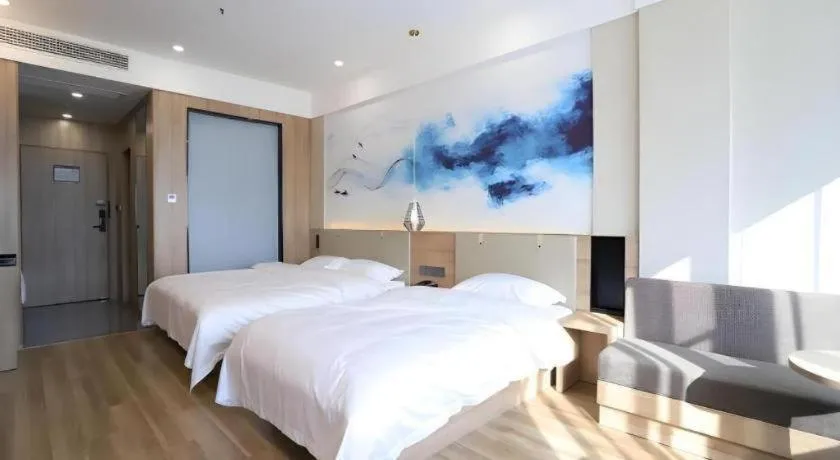 Bed in VX Hotel Jiangsu Taizhou Xinghua RT-Mart