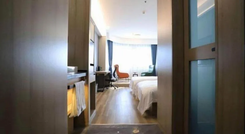 Bed in VX Hotel Jiangsu Taizhou Xinghua RT-Mart