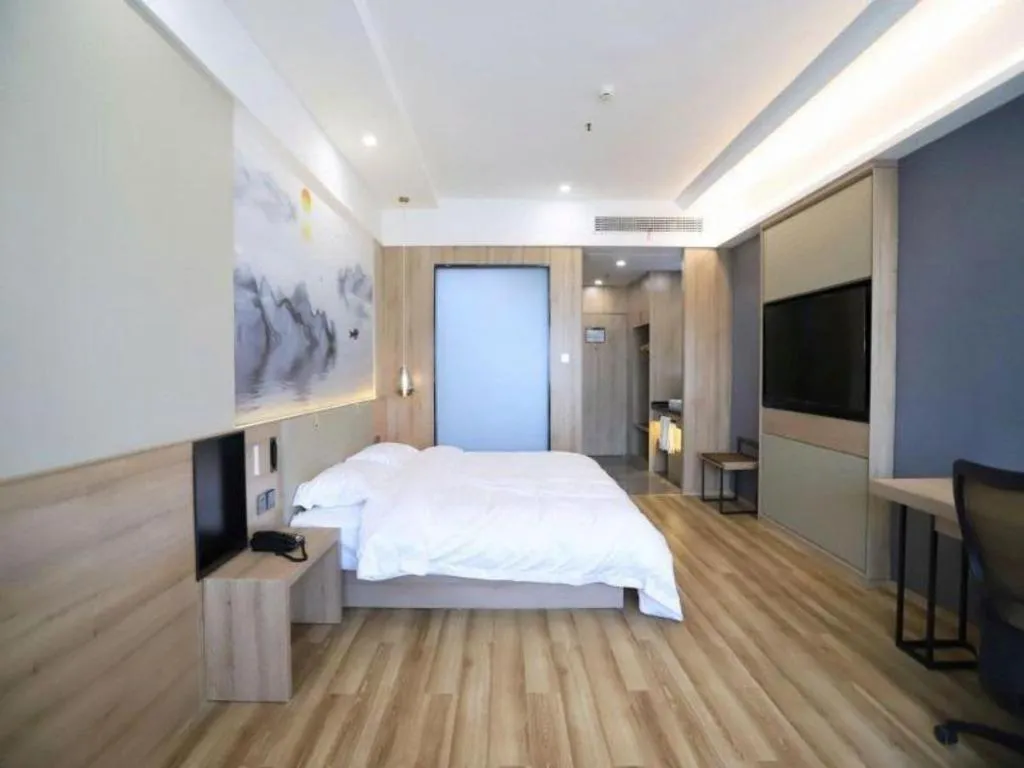 Bed in VX Hotel Jiangsu Taizhou Xinghua RT-Mart