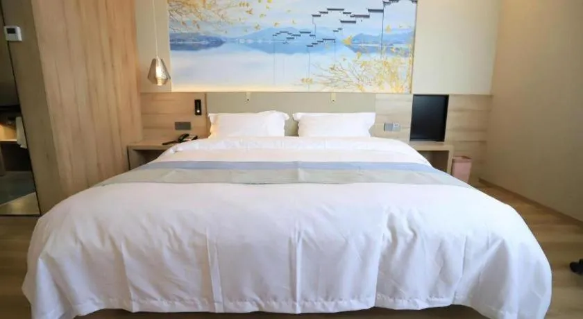 Bed in VX Hotel Jiangsu Taizhou Xinghua RT-Mart