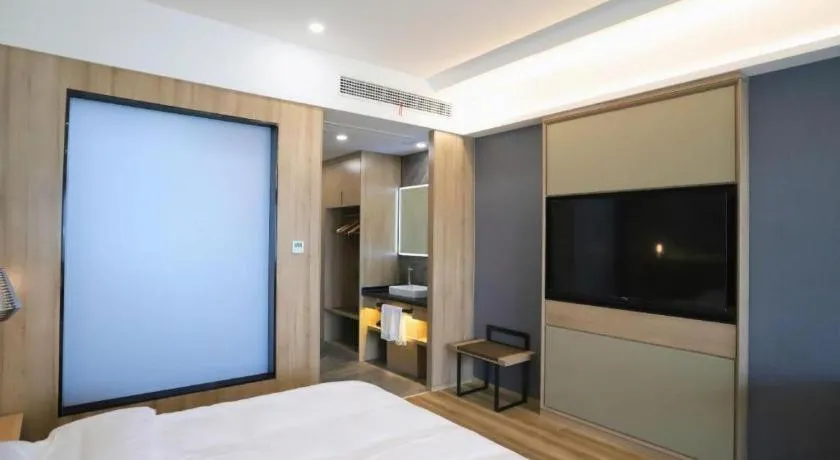 Bed in VX Hotel Jiangsu Taizhou Xinghua RT-Mart