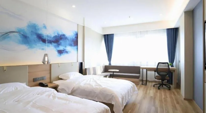 Bed in VX Hotel Jiangsu Taizhou Xinghua RT-Mart