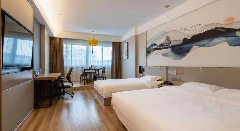 Bed in VX Hotel Jiangsu Taizhou Xinghua RT-Mart