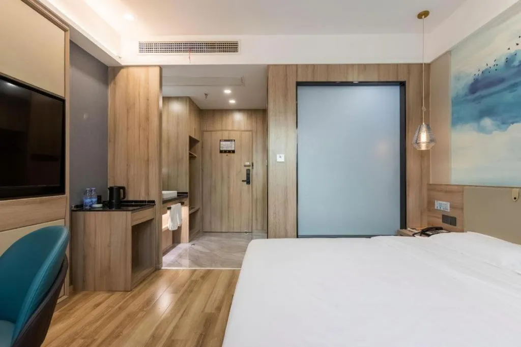 Bed in VX Hotel Jiangsu Taizhou Xinghua RT-Mart