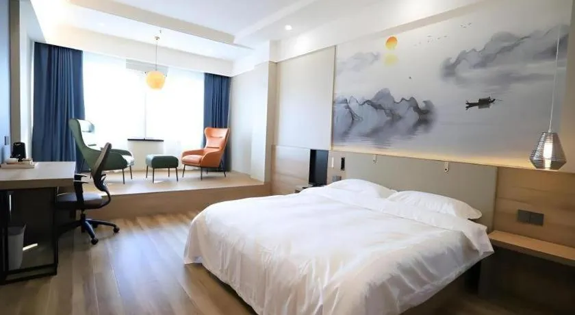 Bed in VX Hotel Jiangsu Taizhou Xinghua RT-Mart
