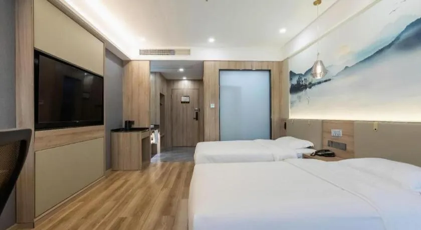 Bed in VX Hotel Jiangsu Taizhou Xinghua RT-Mart