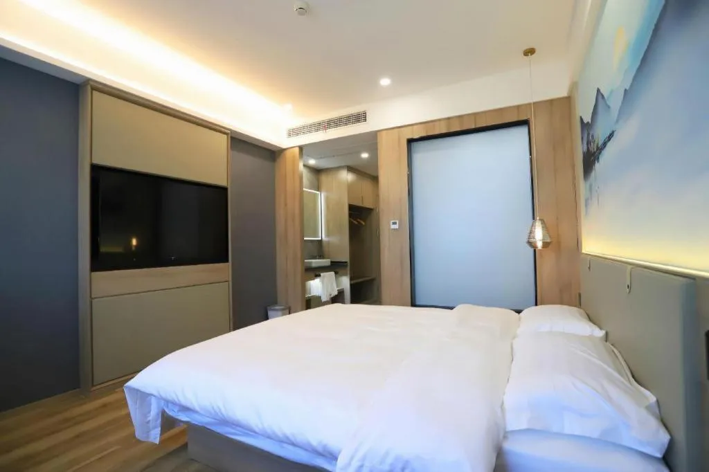 Bed in VX Hotel Jiangsu Taizhou Xinghua RT-Mart