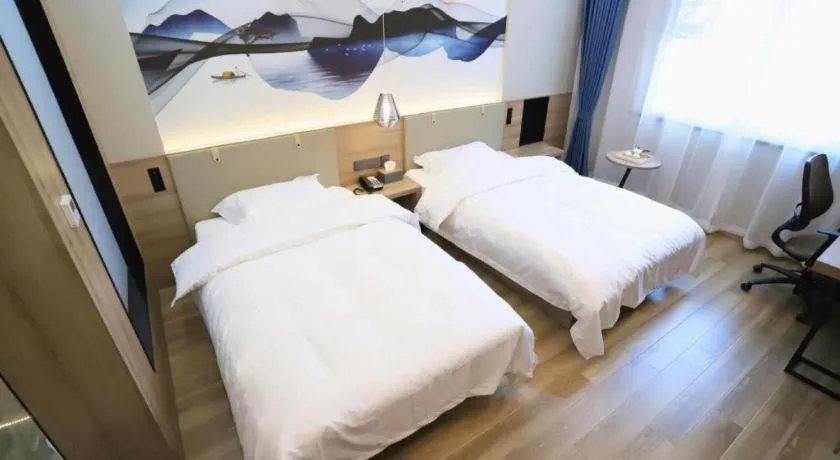 Bed in VX Hotel Jiangsu Taizhou Xinghua RT-Mart