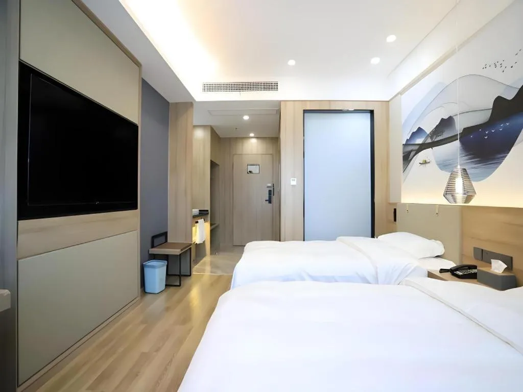 Bed in VX Hotel Jiangsu Taizhou Xinghua RT-Mart