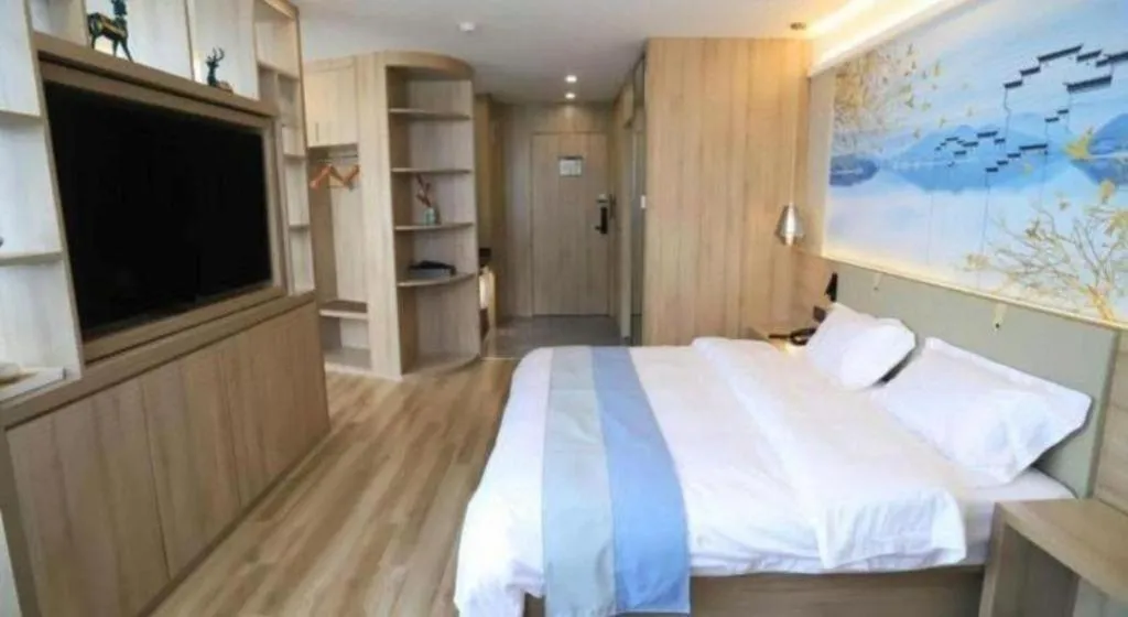 Bed in VX Hotel Jiangsu Taizhou Xinghua RT-Mart