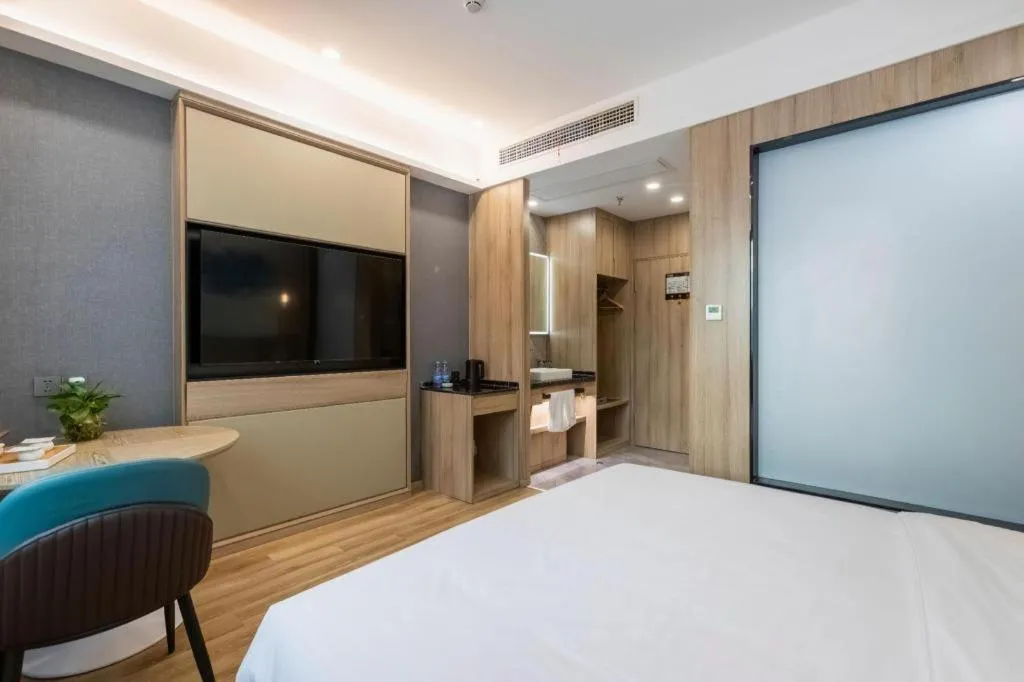 Bed in VX Hotel Jiangsu Taizhou Xinghua RT-Mart