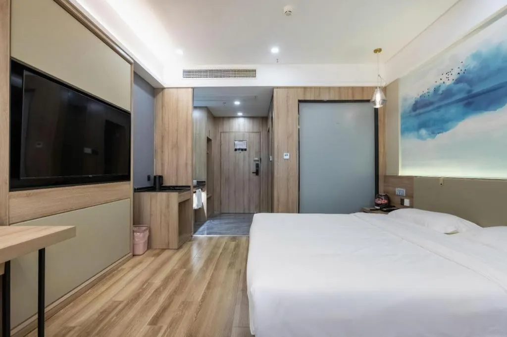 Bed in VX Hotel Jiangsu Taizhou Xinghua RT-Mart