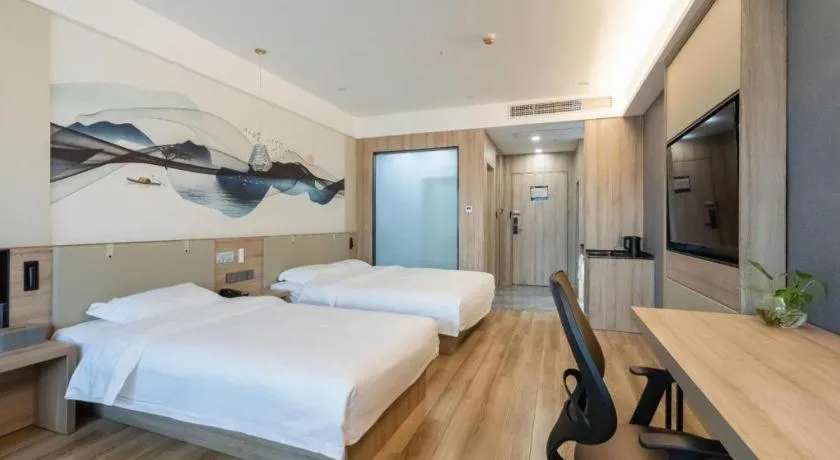 Bed in VX Hotel Jiangsu Taizhou Xinghua RT-Mart