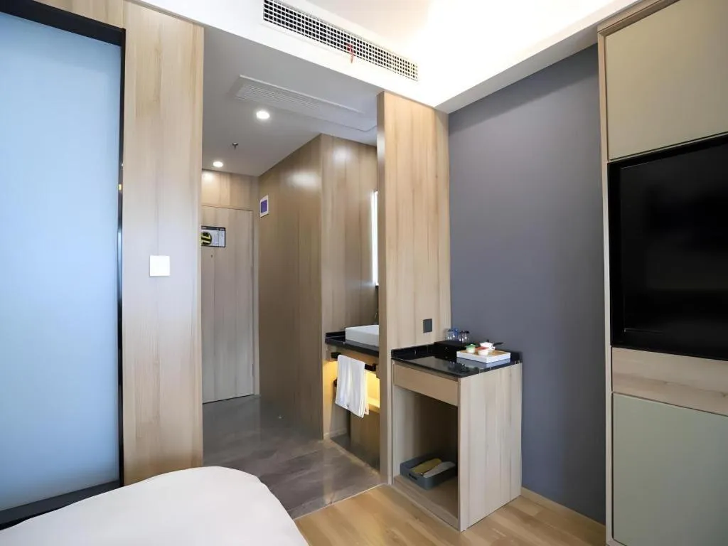 Bed in VX Hotel Jiangsu Taizhou Xinghua RT-Mart