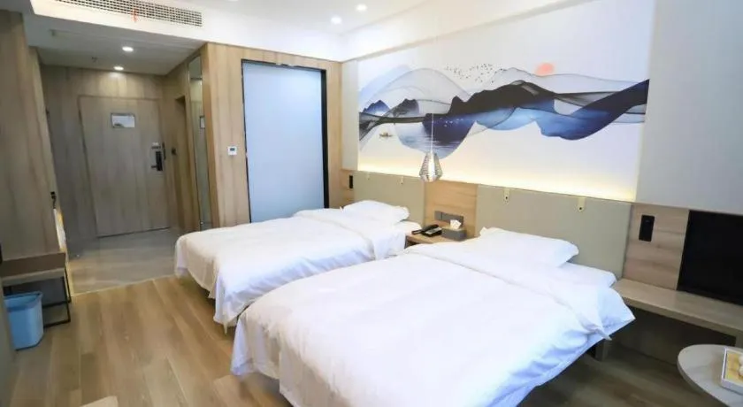 Bed in VX Hotel Jiangsu Taizhou Xinghua RT-Mart