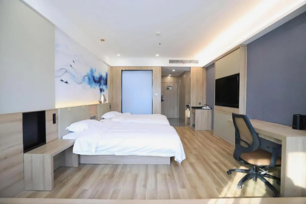 Bed in VX Hotel Jiangsu Taizhou Xinghua RT-Mart