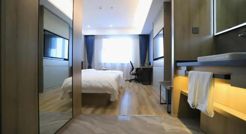 Bed in VX Hotel Jiangsu Taizhou Xinghua RT-Mart