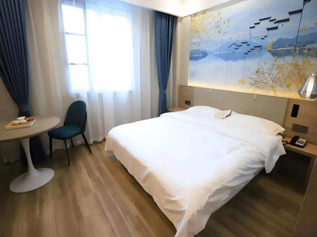 Bed in VX Hotel Jiangsu Taizhou Xinghua RT-Mart