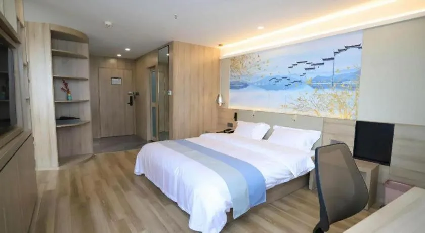 Bed in VX Hotel Jiangsu Taizhou Xinghua RT-Mart