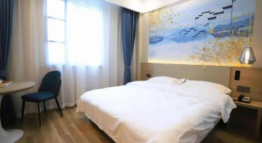 Bed in VX Hotel Jiangsu Taizhou Xinghua RT-Mart