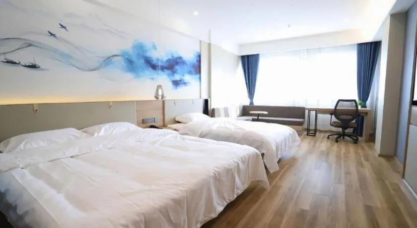 Bed in VX Hotel Jiangsu Taizhou Xinghua RT-Mart