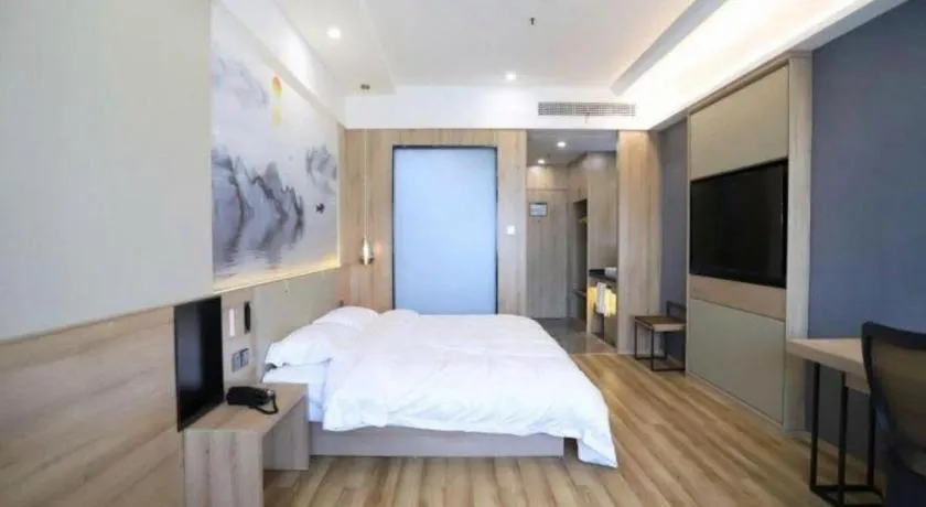 Bed in VX Hotel Jiangsu Taizhou Xinghua RT-Mart