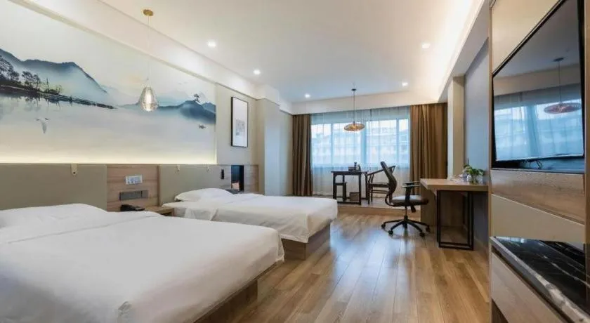 Bed in VX Hotel Jiangsu Taizhou Xinghua RT-Mart