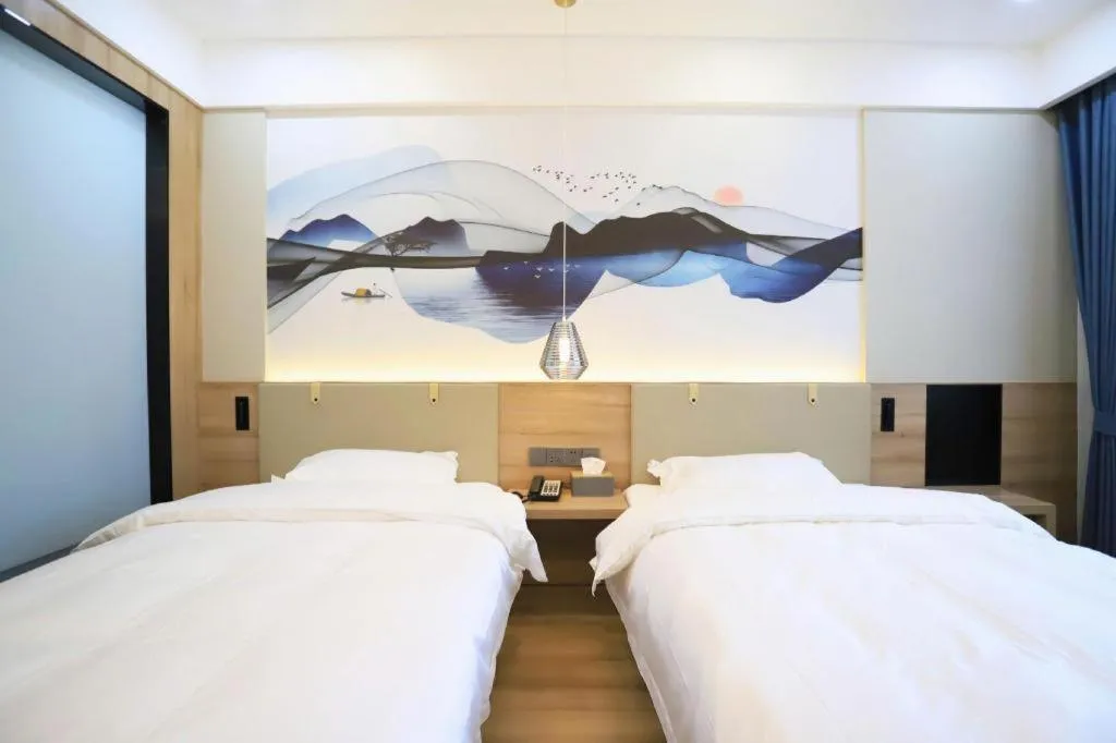 Bed in VX Hotel Jiangsu Taizhou Xinghua RT-Mart