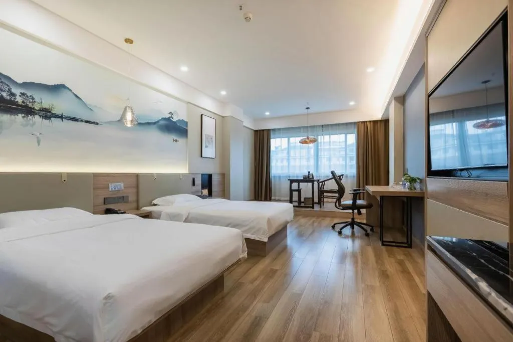 Bed in VX Hotel Jiangsu Taizhou Xinghua RT-Mart