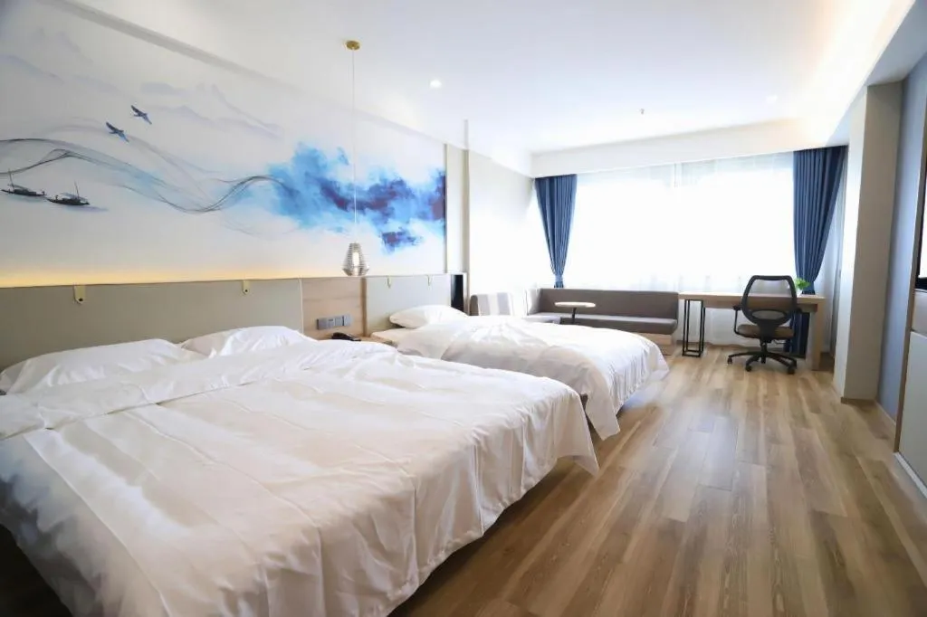 Bed in VX Hotel Jiangsu Taizhou Xinghua RT-Mart