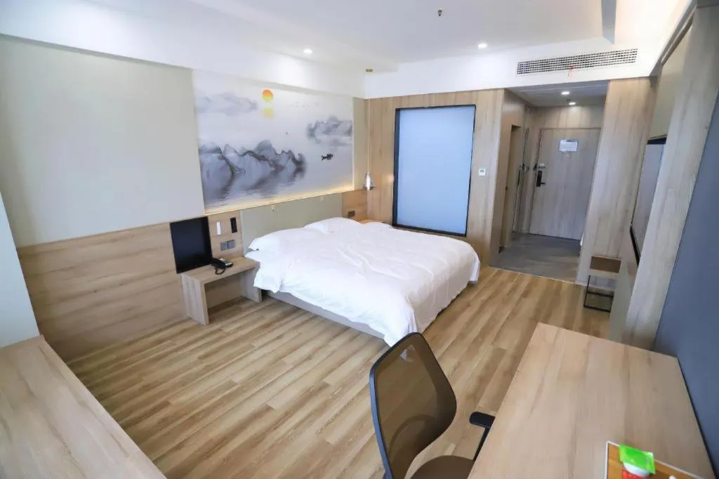 Bed in VX Hotel Jiangsu Taizhou Xinghua RT-Mart