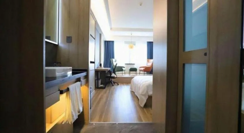 Bed in VX Hotel Jiangsu Taizhou Xinghua RT-Mart